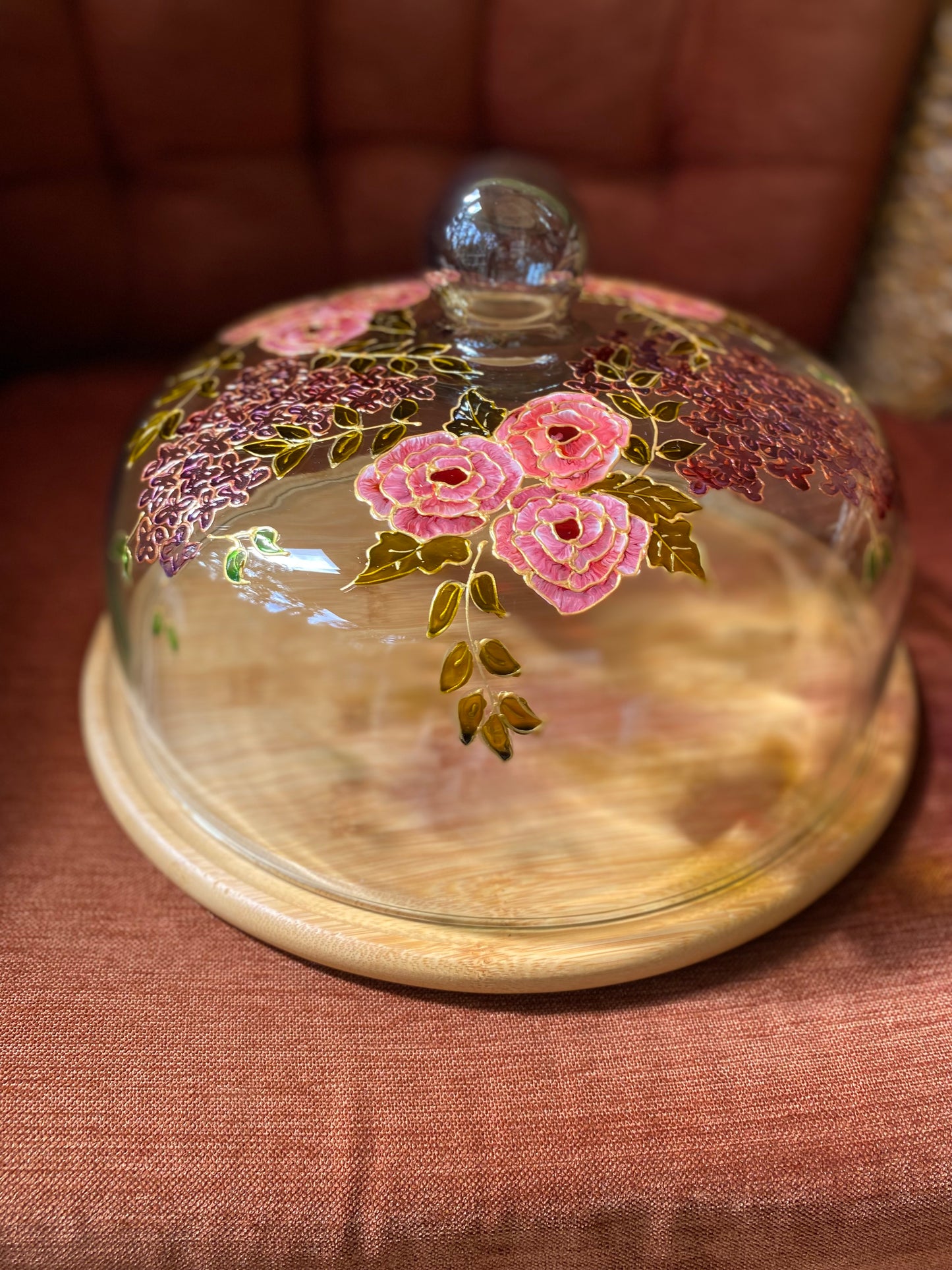 Glass cloche on wooden base