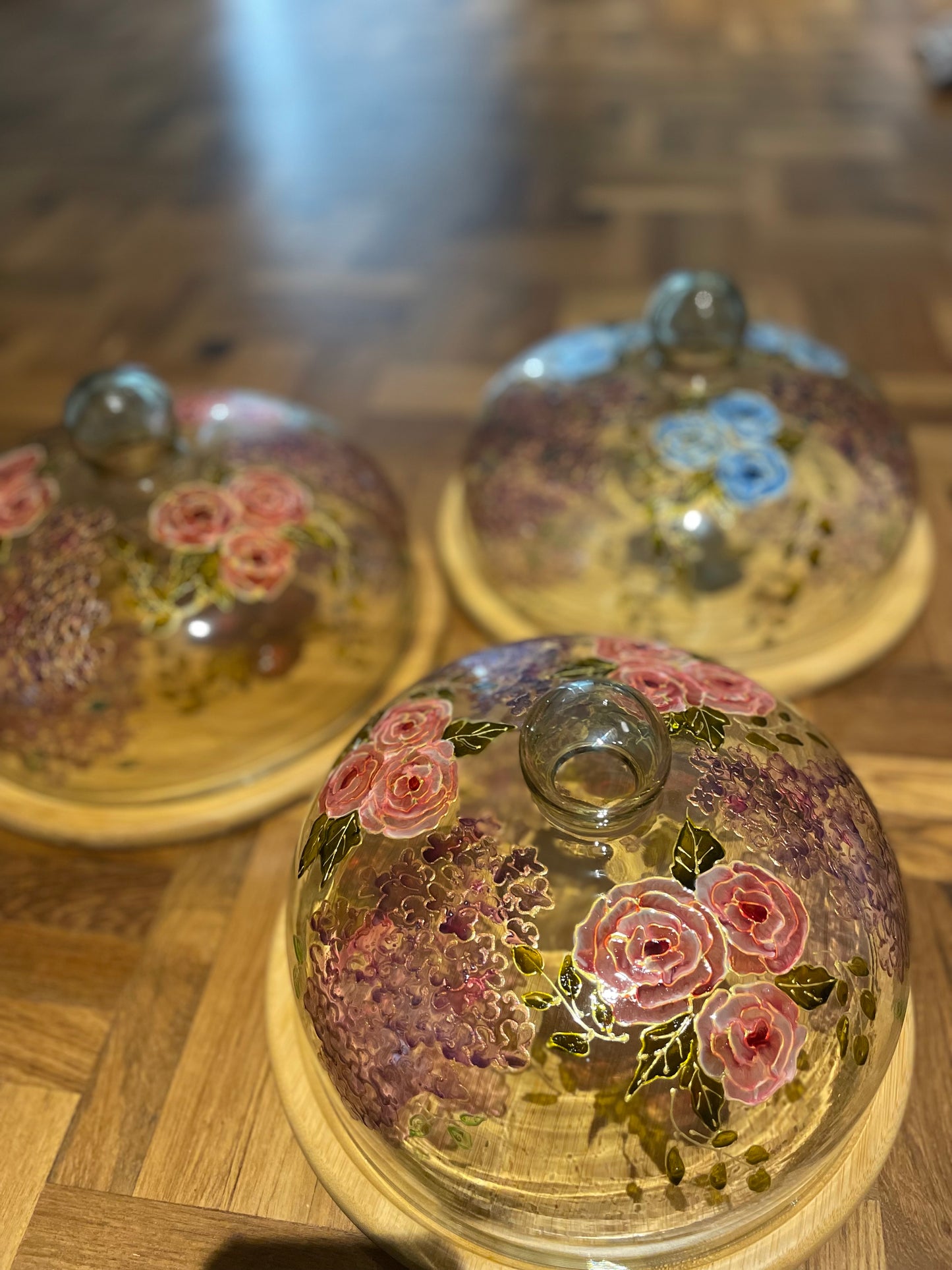 Glass cloche on wooden base